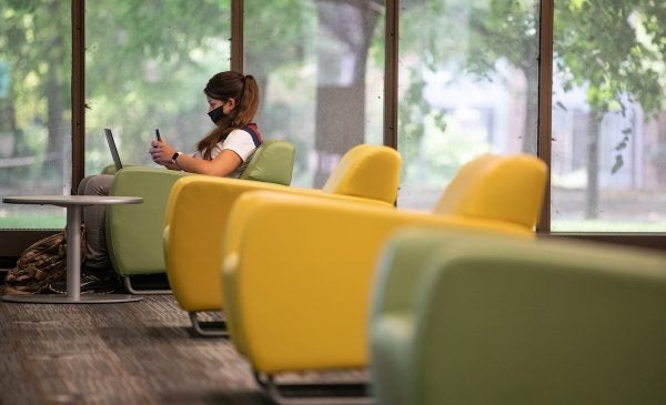 Young woman sitting in a comfortable chair.